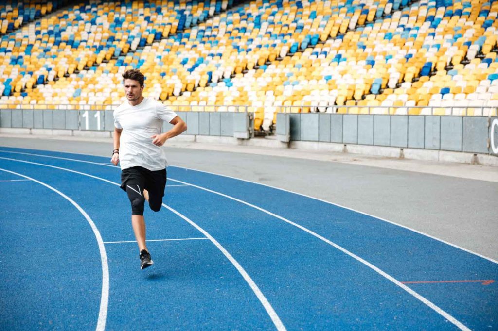 young-sprinter-running-on-athletics-track-at-the-stadium